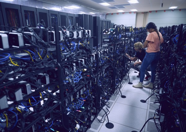 Technicians working in server room