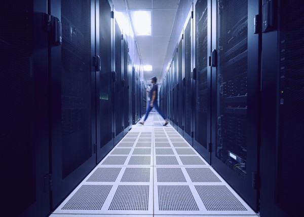 Female technician walking in server room