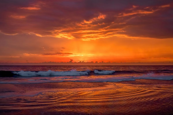 Dramatic sunset sky above ocean