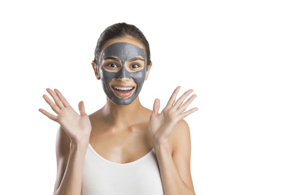 Portrait of young woman with facial beauty mask