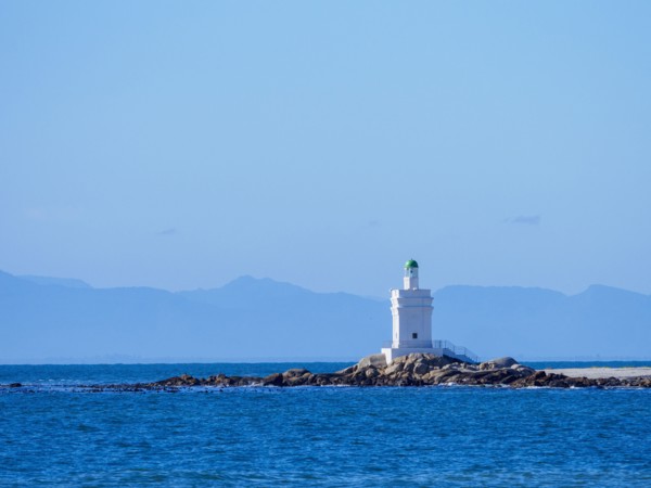 White lighthouse on sea coast