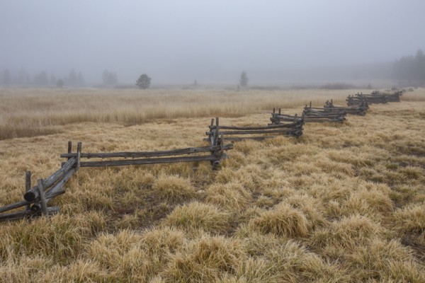 Rail fence in rural scenery at fall