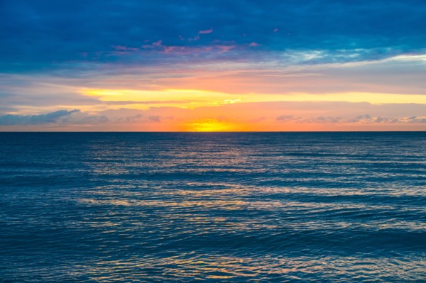 Sunset sky above calm ocean