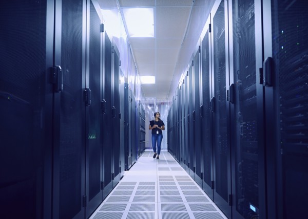 Female technician walking in server room