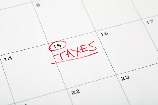 Tax day marked on wall calndar in red