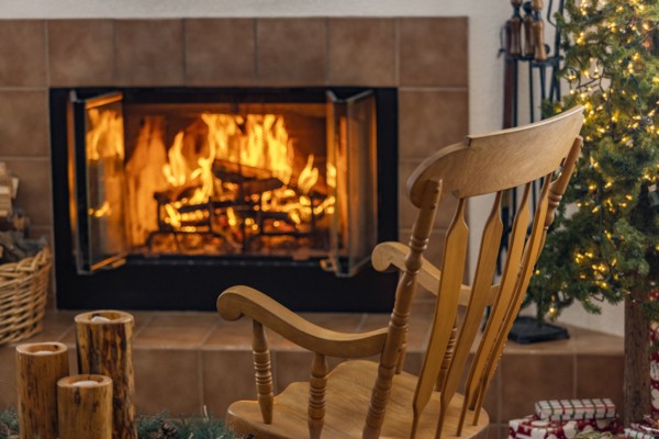 Holiday living room with fireplace and wooden rocking chair