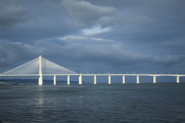 Vasco de Gama bridge under cloudy sky