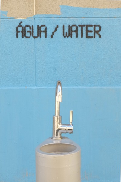 Water fountain and painting on wall
