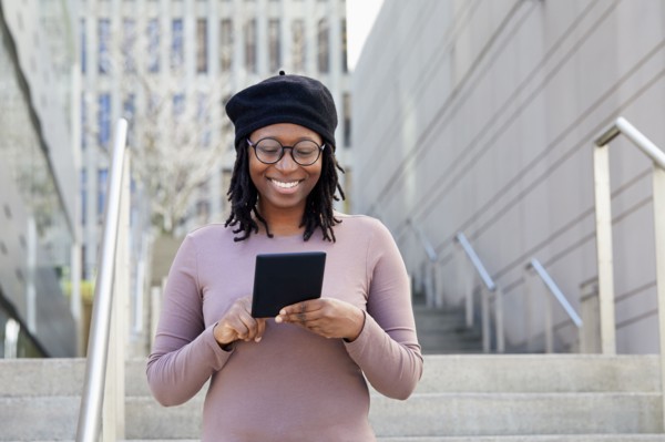 Smiling woman wearing eyeglasses and beret