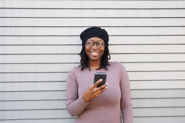 Smiling woman wearing eyeglasses and beret
