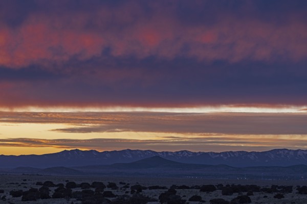 Dramatic sunset sky over Cerrillos Hills State Park desert landscape