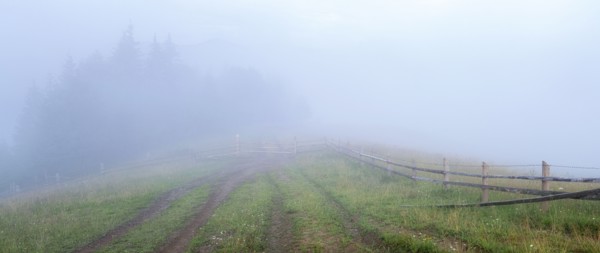 Foggy rural landscape in Carpathian Mountains