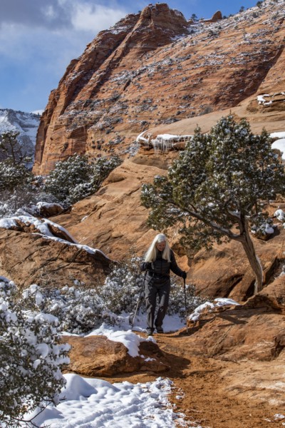 Senior woman hiking in mountains in winter