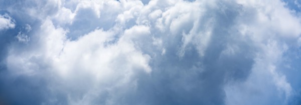 Puffy white and blue clouds on sky
