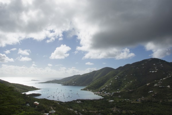 Thick clouds over Coral Bay with sailboats