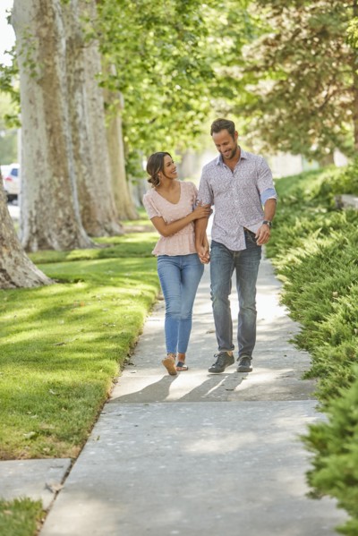 Smiling couple holding hands