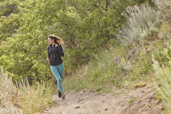 Mid adult woman jogging outdoors