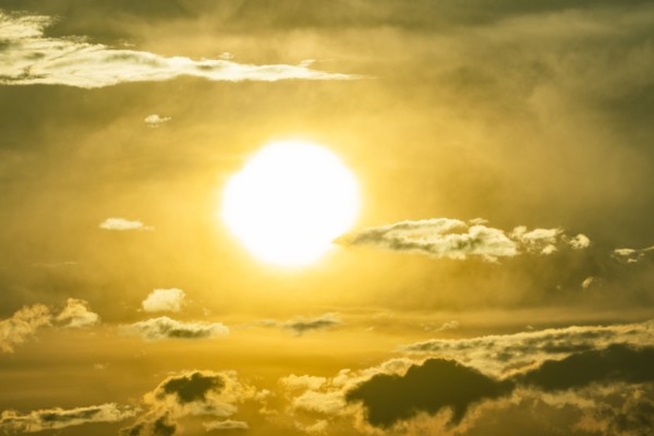 Sky with clouds and setting sun
