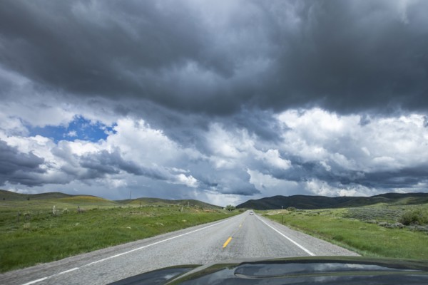 Storm clouds gathering above highway