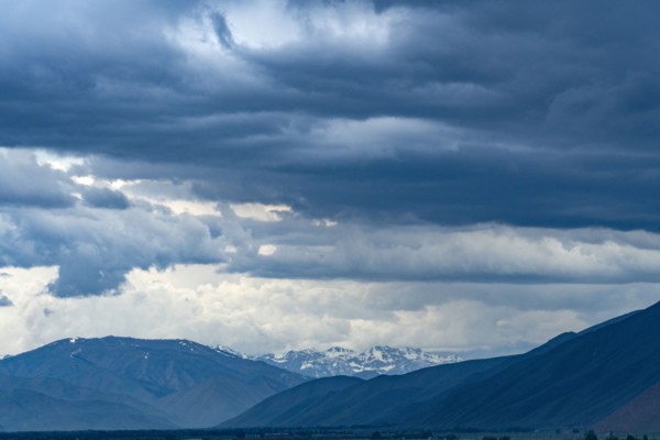 Dramatic view of storm clouds over mountains