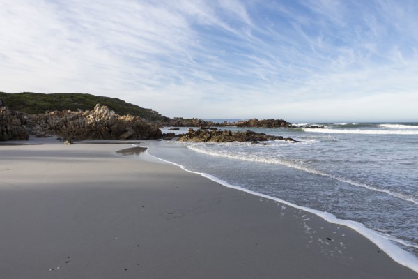 Sandy coastline of Atlantic Ocean in Voelklip Beach