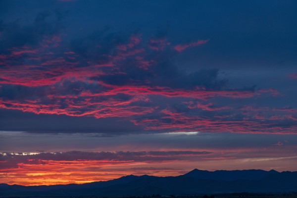 Beautiful sunset over silhouettes of mountains