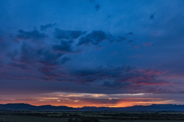 Beautiful sunset over silhouettes of mountains