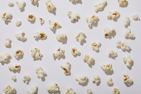 Overhead view of popcorn on white background, New York, NY, USA