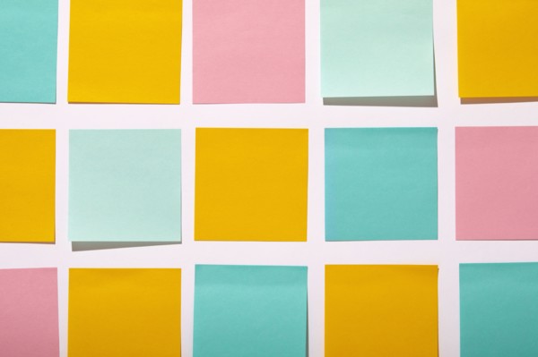 Rows of colorful blank adhesive notes on white background, New York, NY, USA