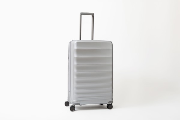 Studio shot of silver rolling suitcase, New York, NY, USA