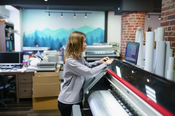 Woman working in printing studio, Omsk, , Russia