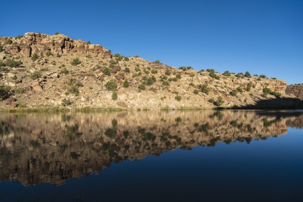Usa, New Mexico, Abiquiu, Rio Chama, Hills reflected in Chama River, Abiquiu, New Mexico, USA
