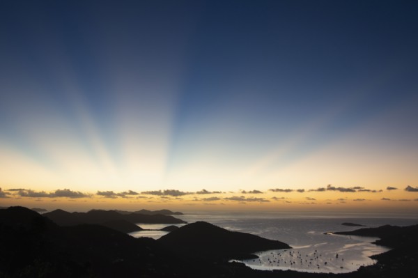USA, United States Virgin Islands, St. John, Sunbeams over Caribbean Sea at sunset, St. John,