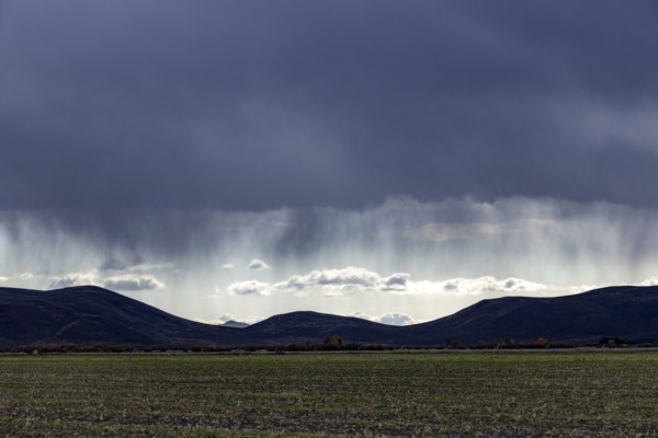 USA, Idaho, Bellevue, Ran and dramatic clouds over landscape, Bellevue, Idaho, USA
