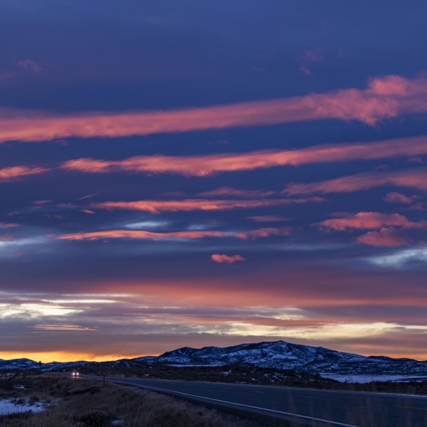 Pink sunset skies over ID-20 outside Mountain Home in snow, Mountain Home, Idaho, USA