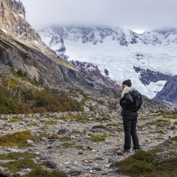 Argentina, Santa Cruz, El Chalten, Female hiker standing on rocks in Electrico Vellay, El Chalten,