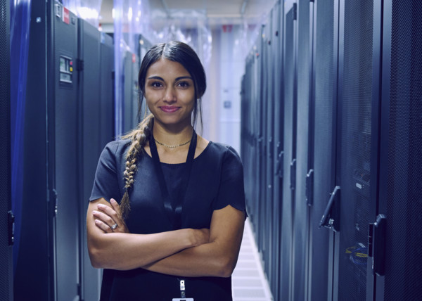 Portrait of smiling female technician in server room 
St, George, Utah, USA