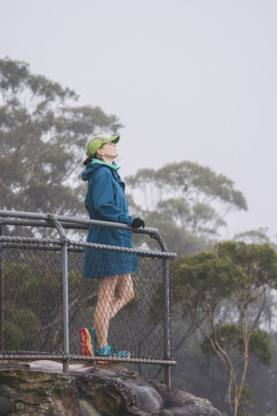 Female hiker in jacket and baseball cap standing on observation point
Katoomba, New South Wales,