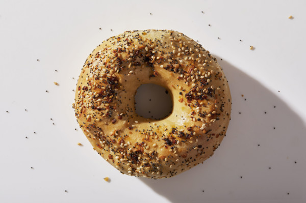 Overhead view of seeded bagel on white background
New York City, NY USA