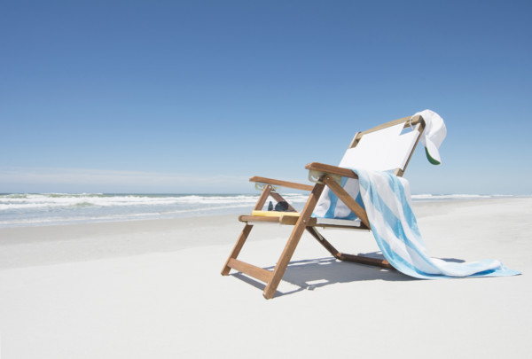 Empty chair with beach towel and baseball cap on beach
Hampstead, North Carolina, USA