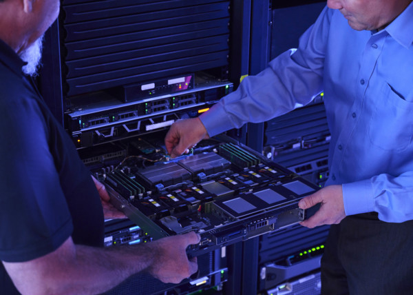 Two men working in data center