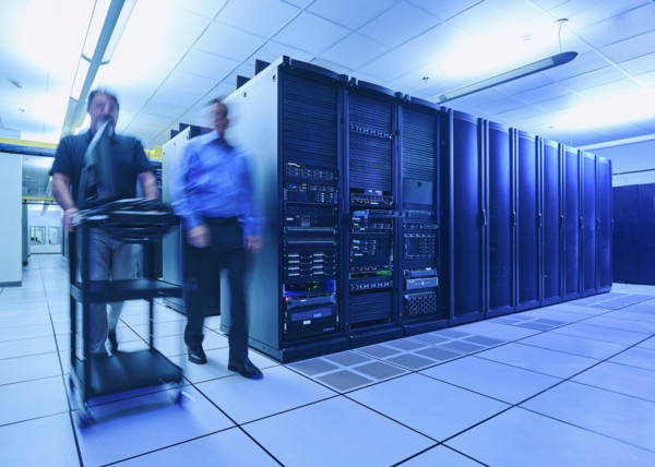Two men walking in data center