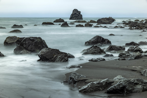 USA, Oregon, Brookings, Sea waves on rocky coast, long exposure