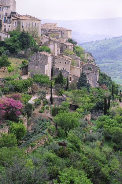France, Gorde, Stone houses and trees on hillside