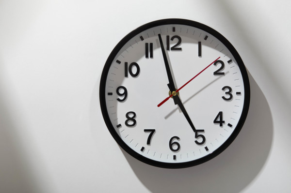 Wall clock on light streaked background