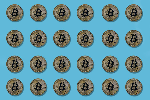 Multiple bitcoin on blue background