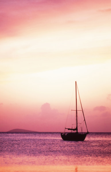 USA, United States Virgin Islands, St. Thomas, Silhouette of sailboat on Pillsbury Sound at sunrise