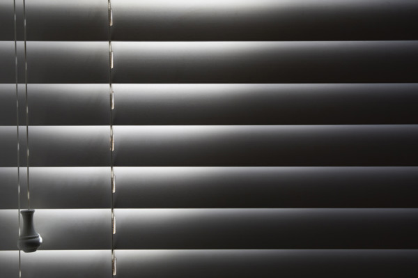 Close-up of window blinds with sunlight. New York City, New York State, USA.