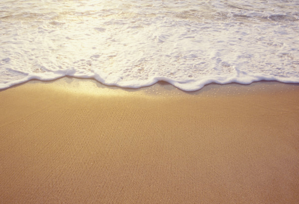 Close-up of sea wave washing sandy beach. Spring Lake, New Jersey, USA.