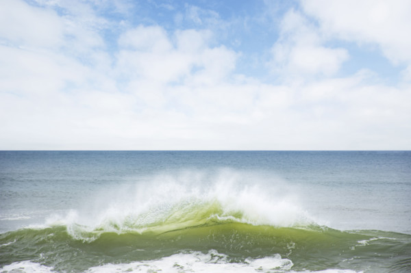 Ocean wave splashing on shore. Nantucket, Massachusetts, USA.